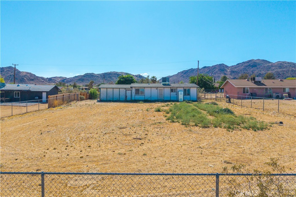 4805 Avenida La Mirada Joshua Tree, CA 92252 - Photo 28 of 38 a view of a lake with a mountain in the background