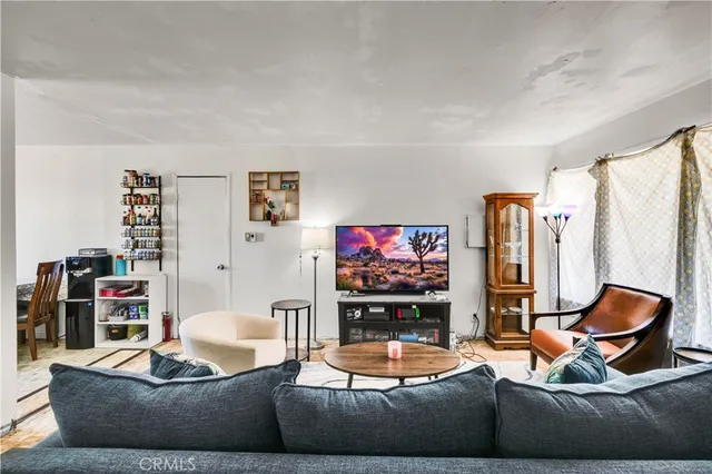 a kitchen with a refrigerator a sink and cabinets