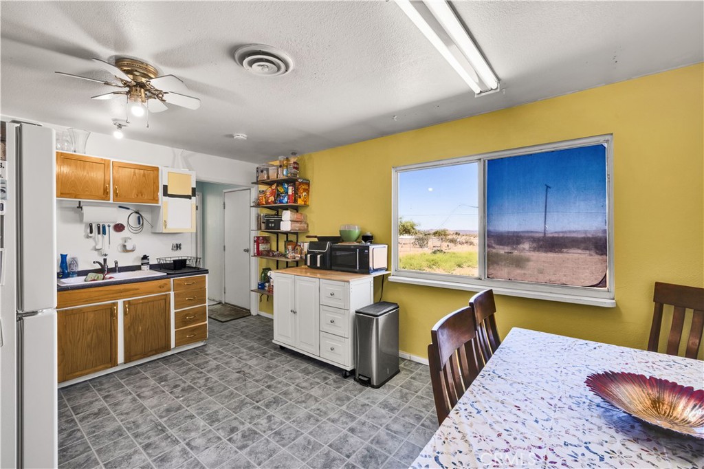 4805 Avenida La Mirada Joshua Tree, CA 92252 - Photo 9 of 38 a bed room with a bed and furniture