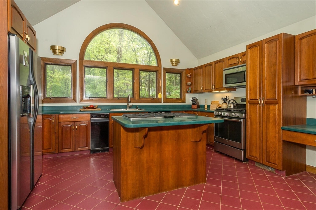 45 Strawberry Lane Canton, MA 02021 - Photo 12 of 32 a kitchen with stainless steel appliances granite countertop a stove a sink dishwasher and a refrigerator