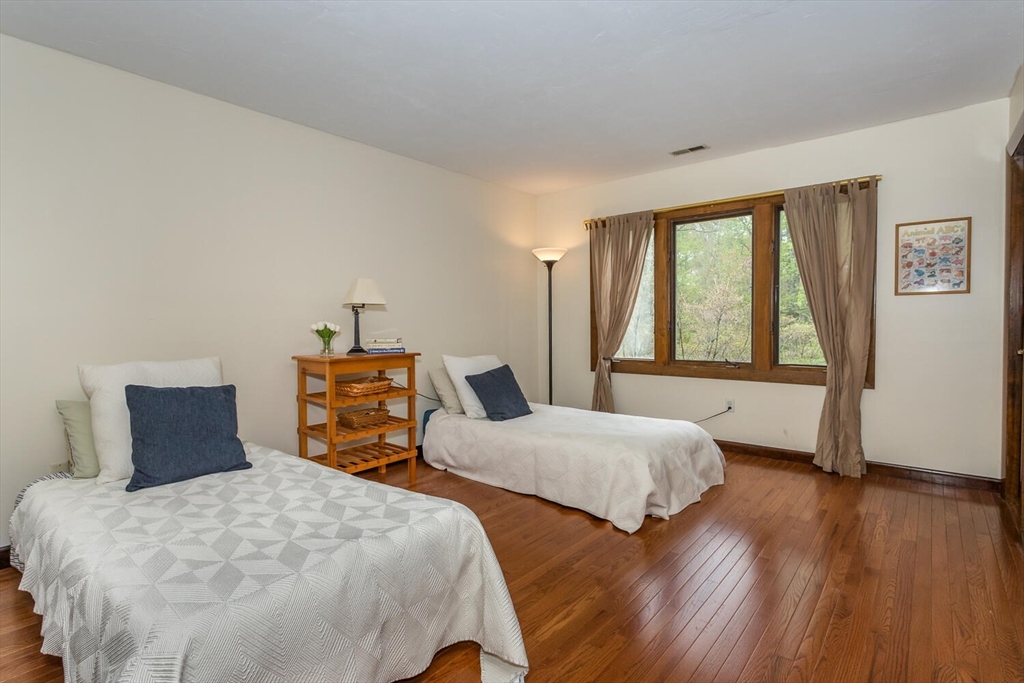 45 Strawberry Lane Canton, MA 02021 - Photo 24 of 32 a bedroom with two beds and a large window