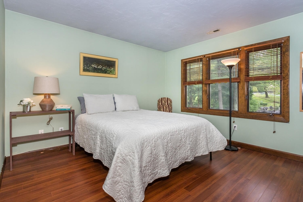 45 Strawberry Lane Canton, MA 02021 - Photo 27 of 32 a bedroom with a large bed and a window