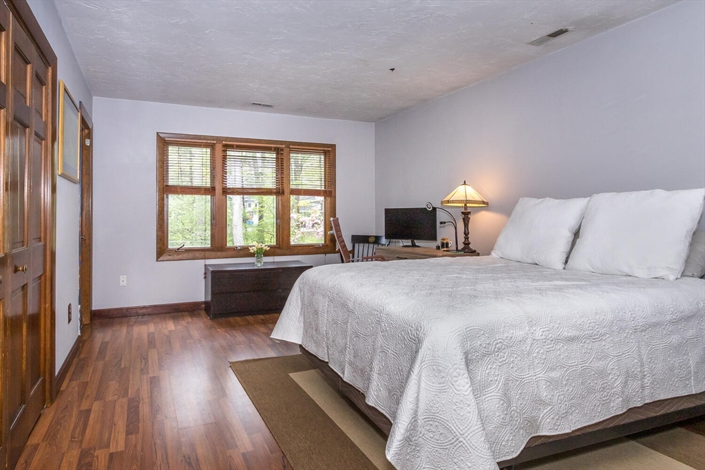 45 Strawberry Lane Canton, MA 02021 - Photo 28 of 32 a bedroom with a bed and a large window