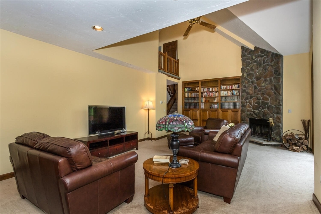 45 Strawberry Lane Canton, MA 02021 - Photo 8 of 32 a living room with furniture and a flat screen tv