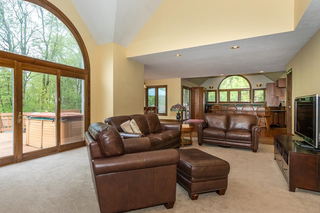 45 Strawberry Lane Canton, MA 02021 - Photo 9 of 32 a living room with furniture and a flat screen tv