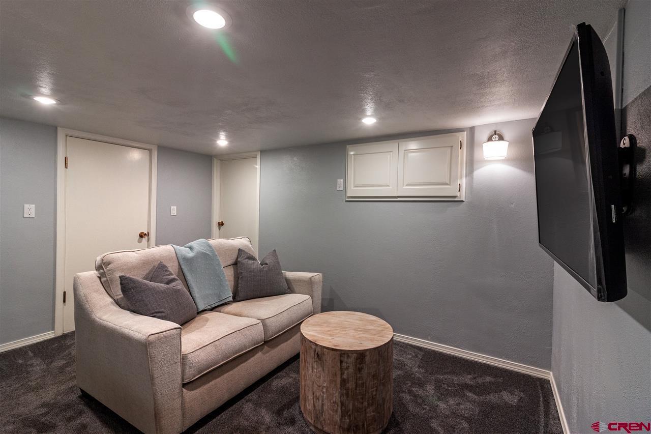 1404 East 3rd Avenue Durango, CO 81301 - Photo 15 of 24 a living room with furniture and a couch