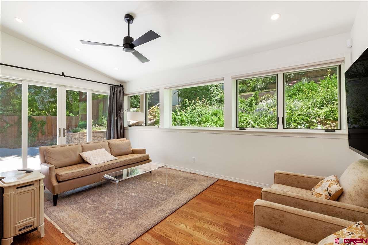 1404 East 3rd Avenue Durango, CO 81301 - Photo 9 of 24 a living room with furniture and a large window with outer view