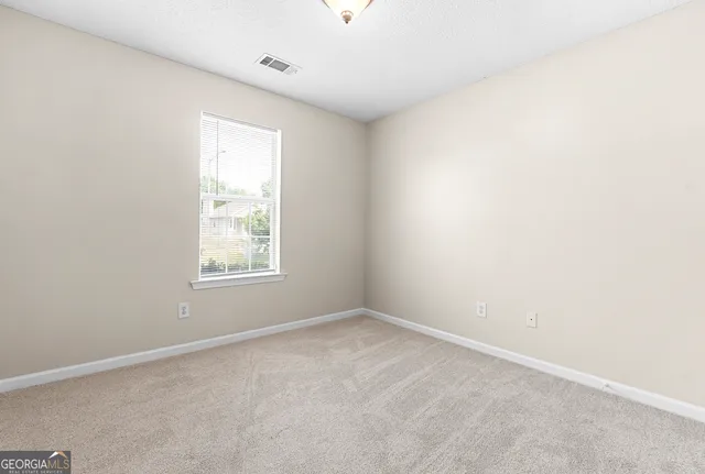 a bathroom with a toilet sink vanity and mirror