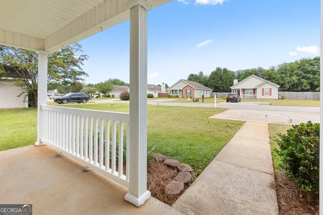 a view of a garden with a large trees