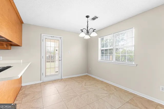 a kitchen with stainless steel appliances granite countertop a sink and a cabinets