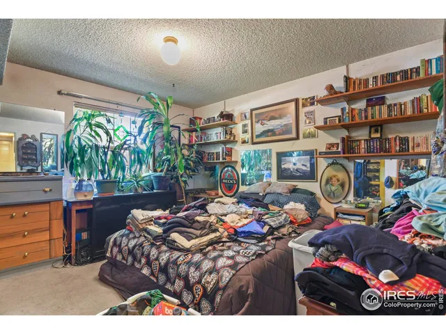 a bedroom with furniture and a bed