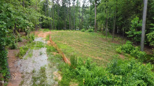 a view of outdoor space with trees all around