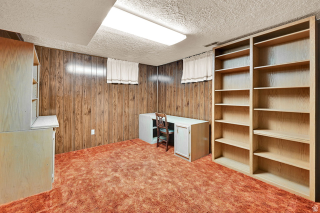 2467 South 2000 West Syracuse, UT 84075 - Photo 24 of 28 Room with wood-panel walls, built-in shelving, and carpet flooring