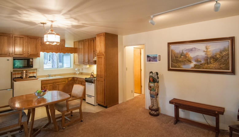 293 Cedar Road Trinity Center, CA 96091 - Photo 6 of 14 a kitchen with furniture and a refrigerator