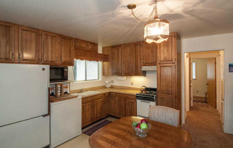 293 Cedar Road Trinity Center, CA 96091 - Photo 8 of 14 a kitchen with cabinets a sink and stainless steel appliances
