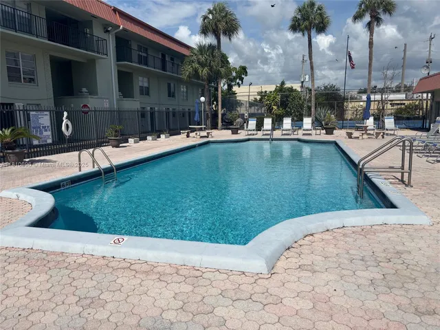 a view of a swimming pool with a chair