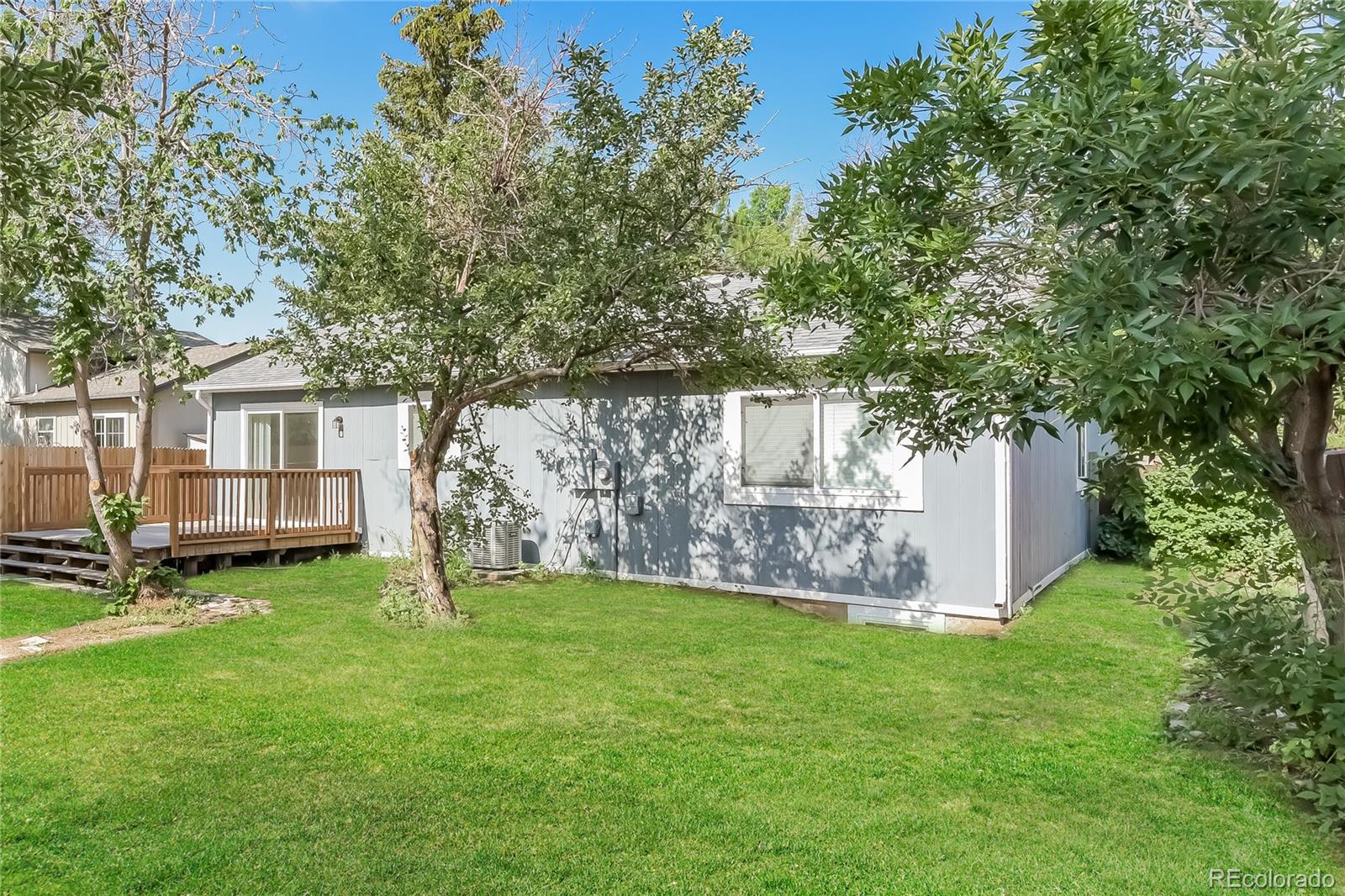 16797 East Mansfield Circle Aurora, CO 80013 - Photo 14 of 17 a view of a house with a yard and sitting area