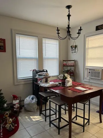 a view of a dining room with furniture and window
