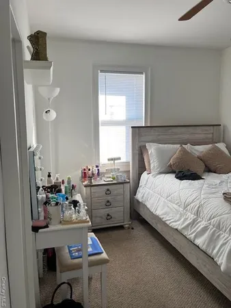 a bedroom with a bed and a table