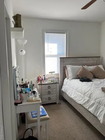 a bedroom with a bed and a table