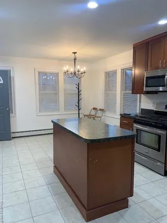 a kitchen with stainless steel appliances a sink and a stove
