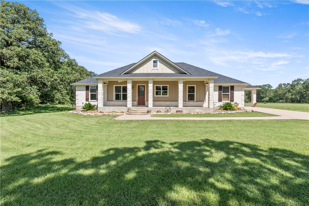 6701 Old Reliance Road Bryan, TX 77808 - Photo 3 of 44 a front view of a house with a yard table and chairs