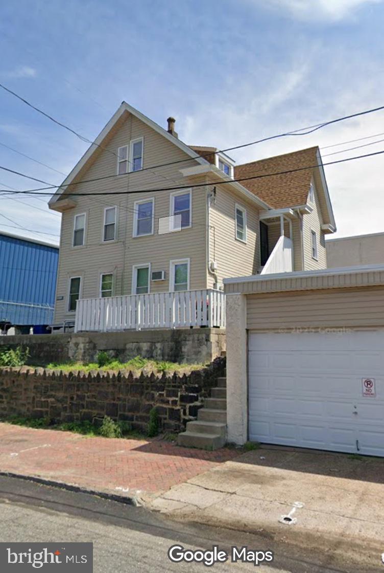 2213 Wakeling Street Philadelphia, PA 19137 - Photo 1 of 8 a front view of a house with a yard
