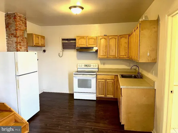 a kitchen with stainless steel appliances a refrigerator stove and sink