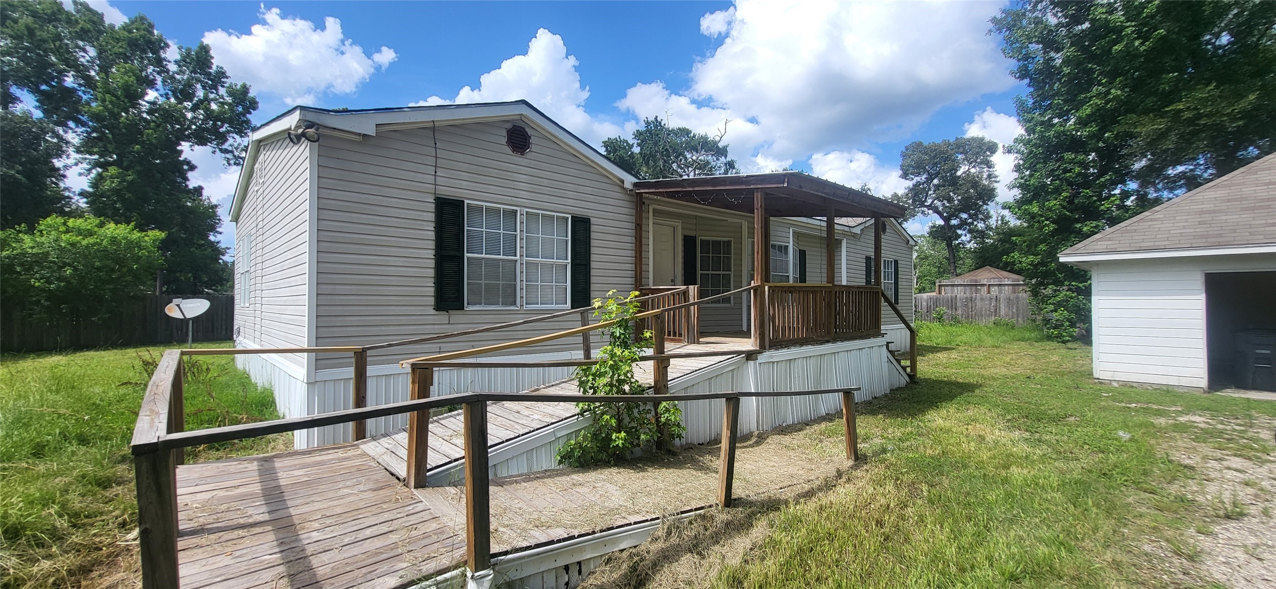 16711 Lake Circle Conroe, TX 77302 - Photo 1 of 20 a front view of a house with garden