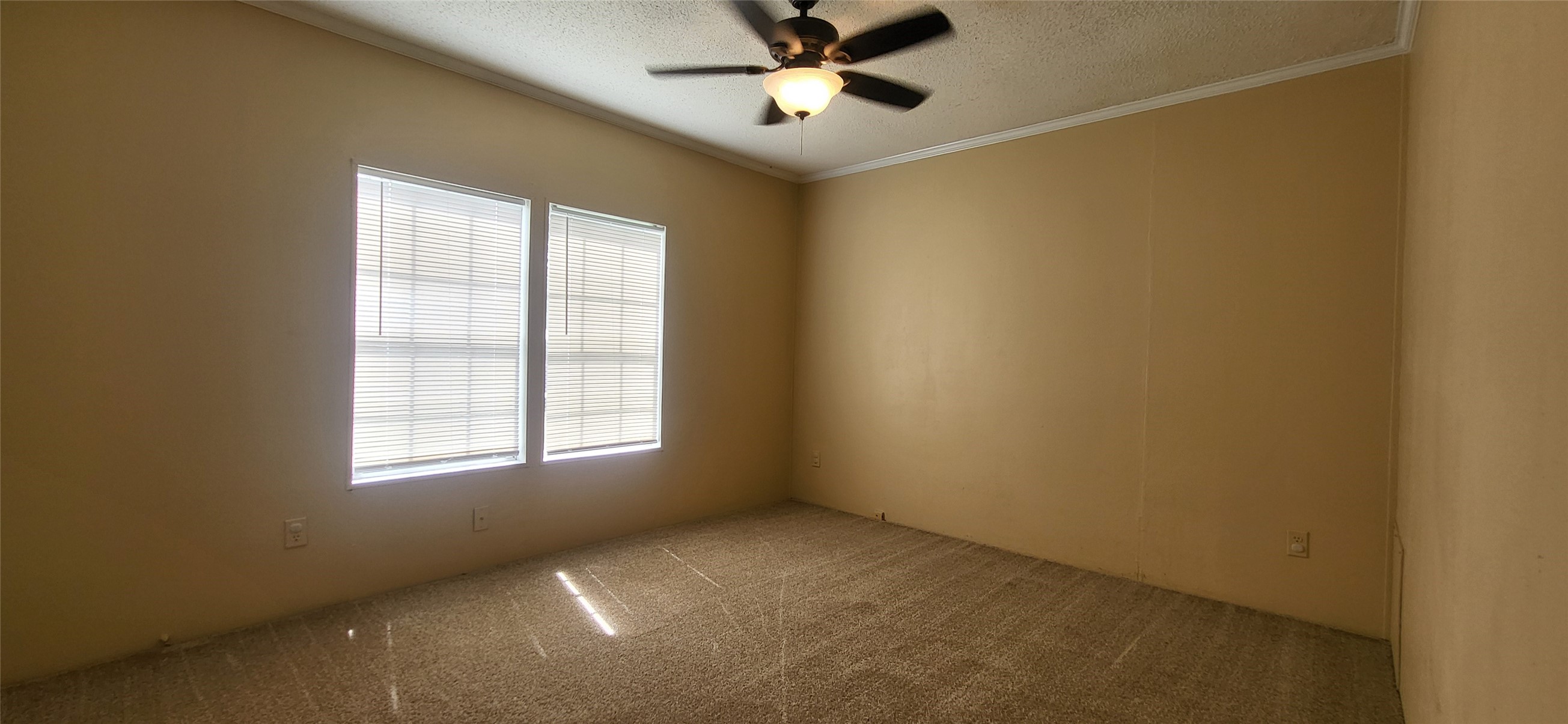 16711 Lake Circle Conroe, TX 77302 - Photo 16 of 20 an empty room with a window and a fan