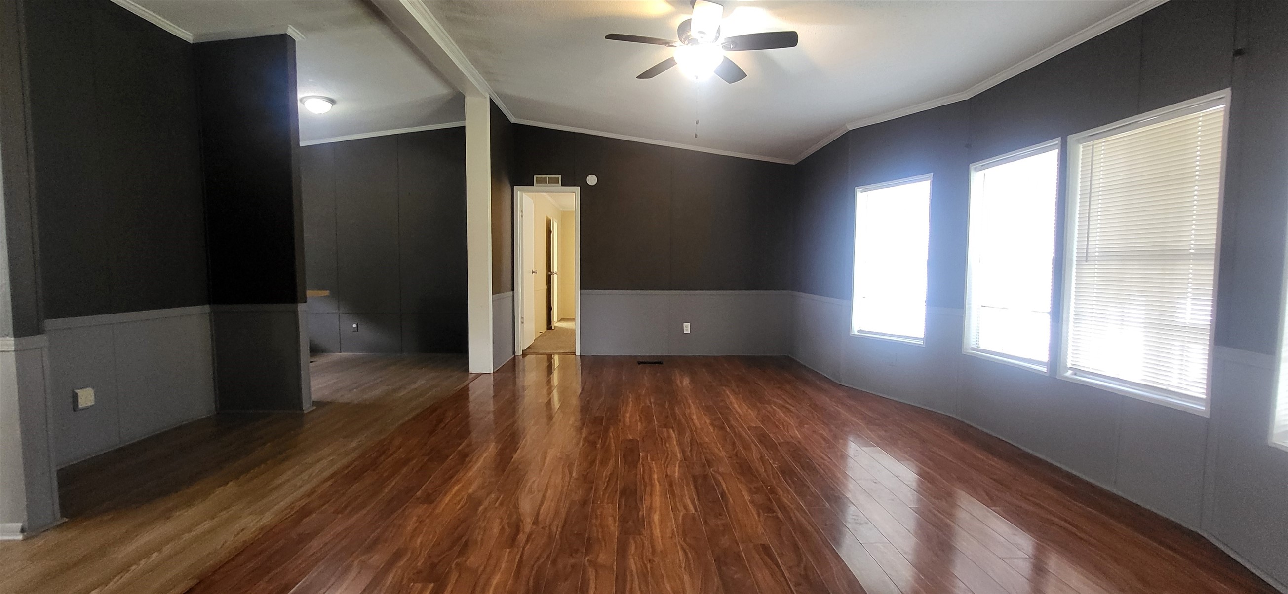 16711 Lake Circle Conroe, TX 77302 - Photo 4 of 20 wooden floor in an empty room with a window