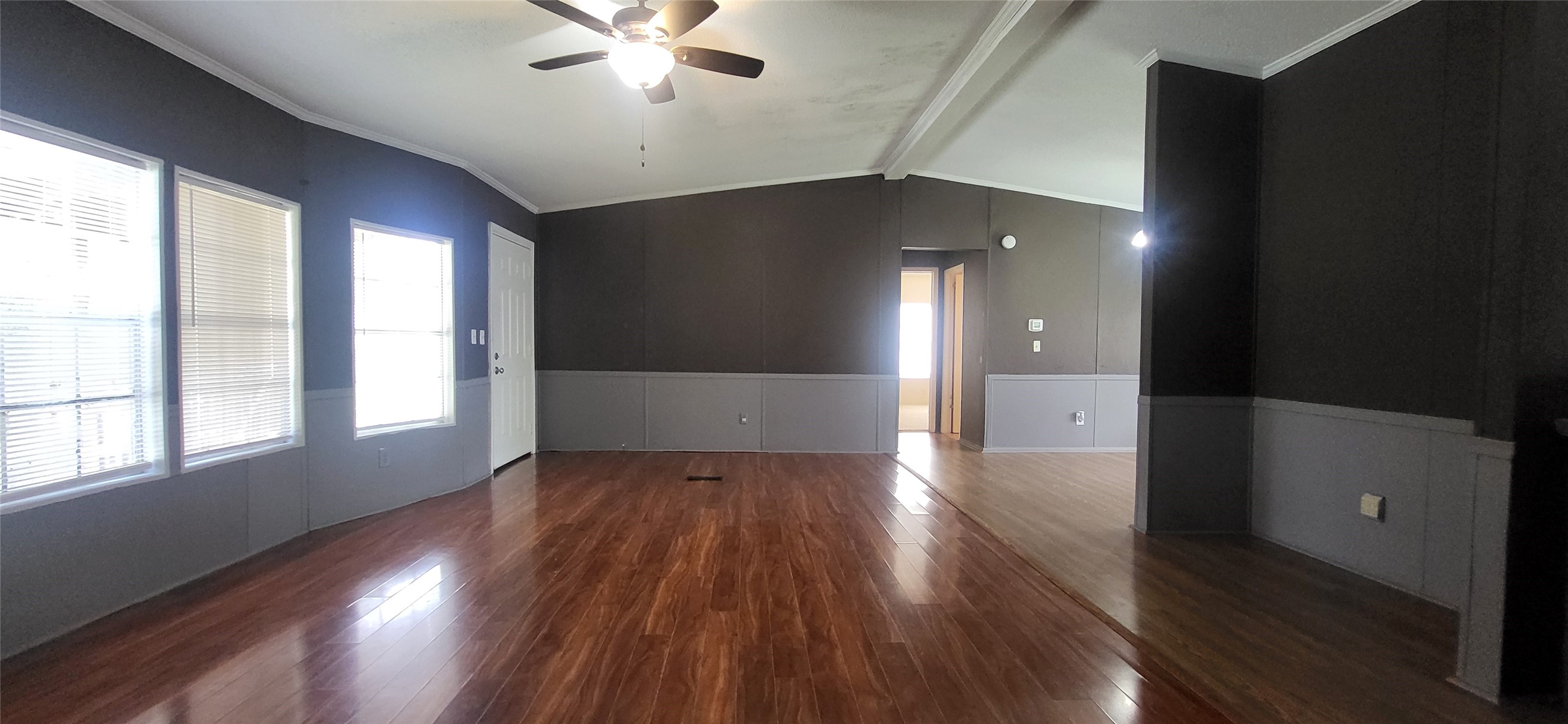 16711 Lake Circle Conroe, TX 77302 - Photo 5 of 20 an empty room with wooden floor and windows
