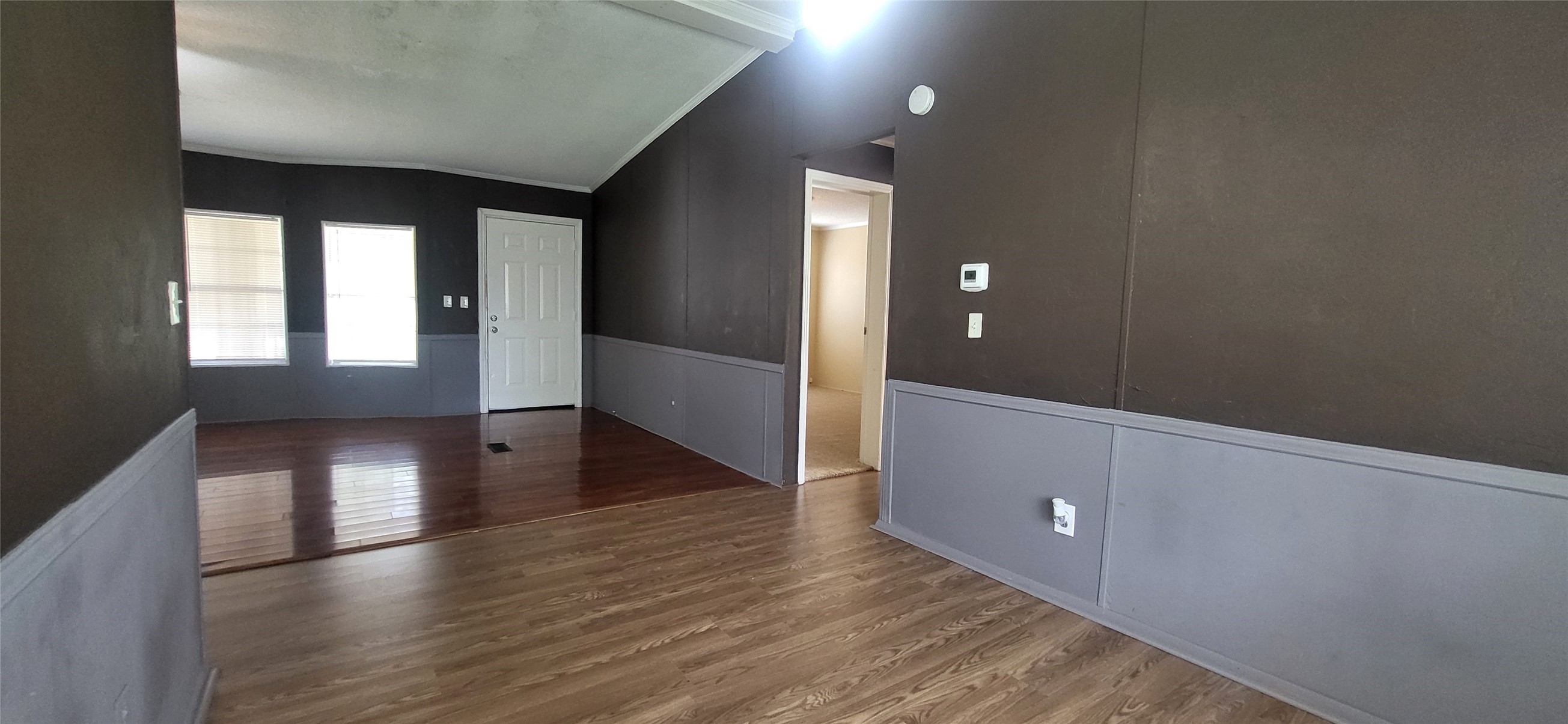 16711 Lake Circle Conroe, TX 77302 - Photo 7 of 20 a view of an empty room with wooden floor and a window