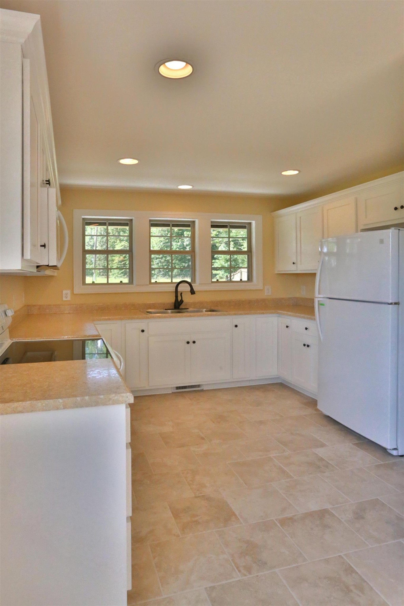 64 Brown Road Lebanon, TN 37087 - Photo 5 of 15 a kitchen with granite countertop a refrigerator and a sink
