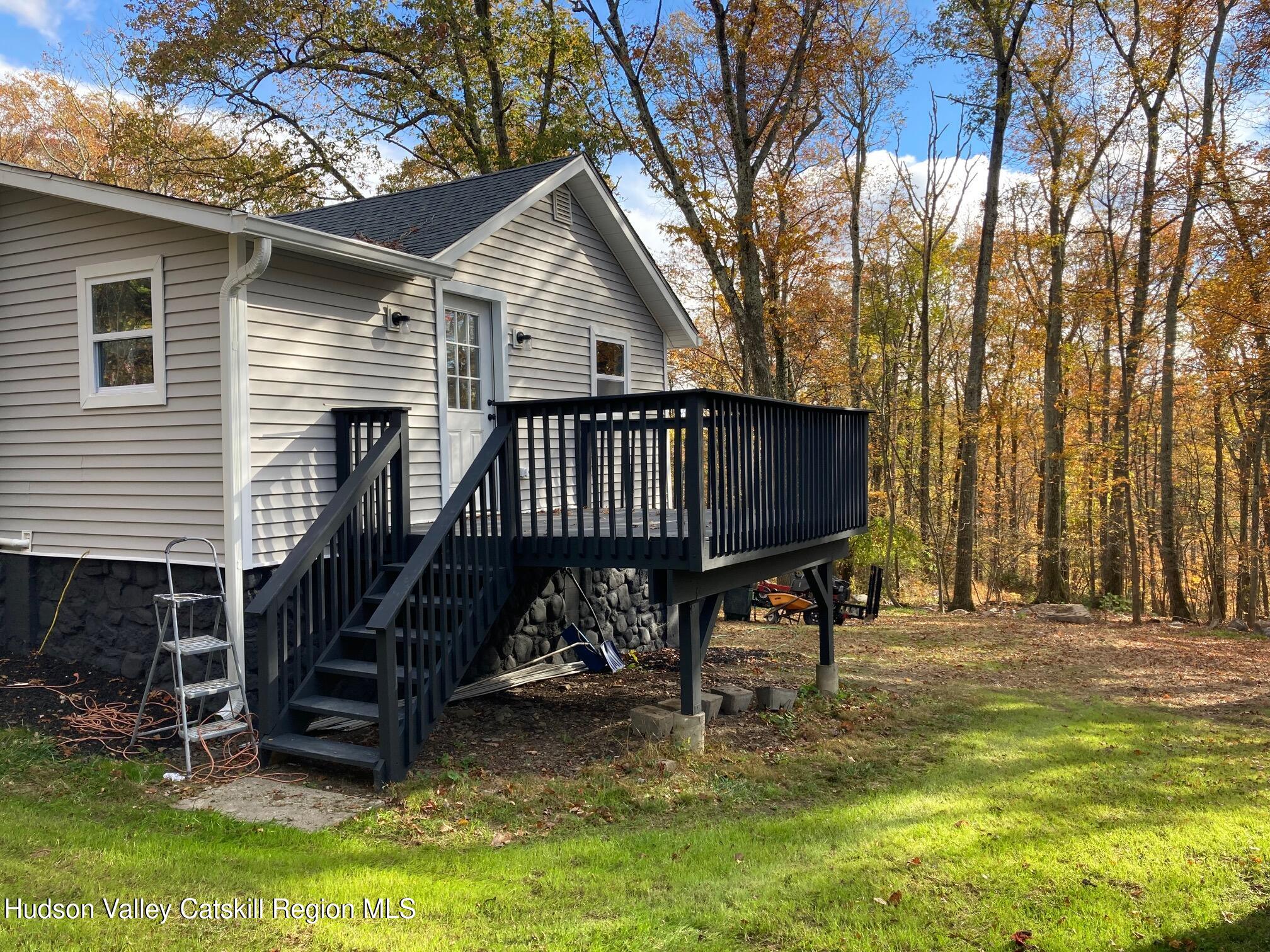 6 Elm Road Wurtsboro, NY 12790 - Photo 12 of 12 a view of a house with a yard chairs and iron fence