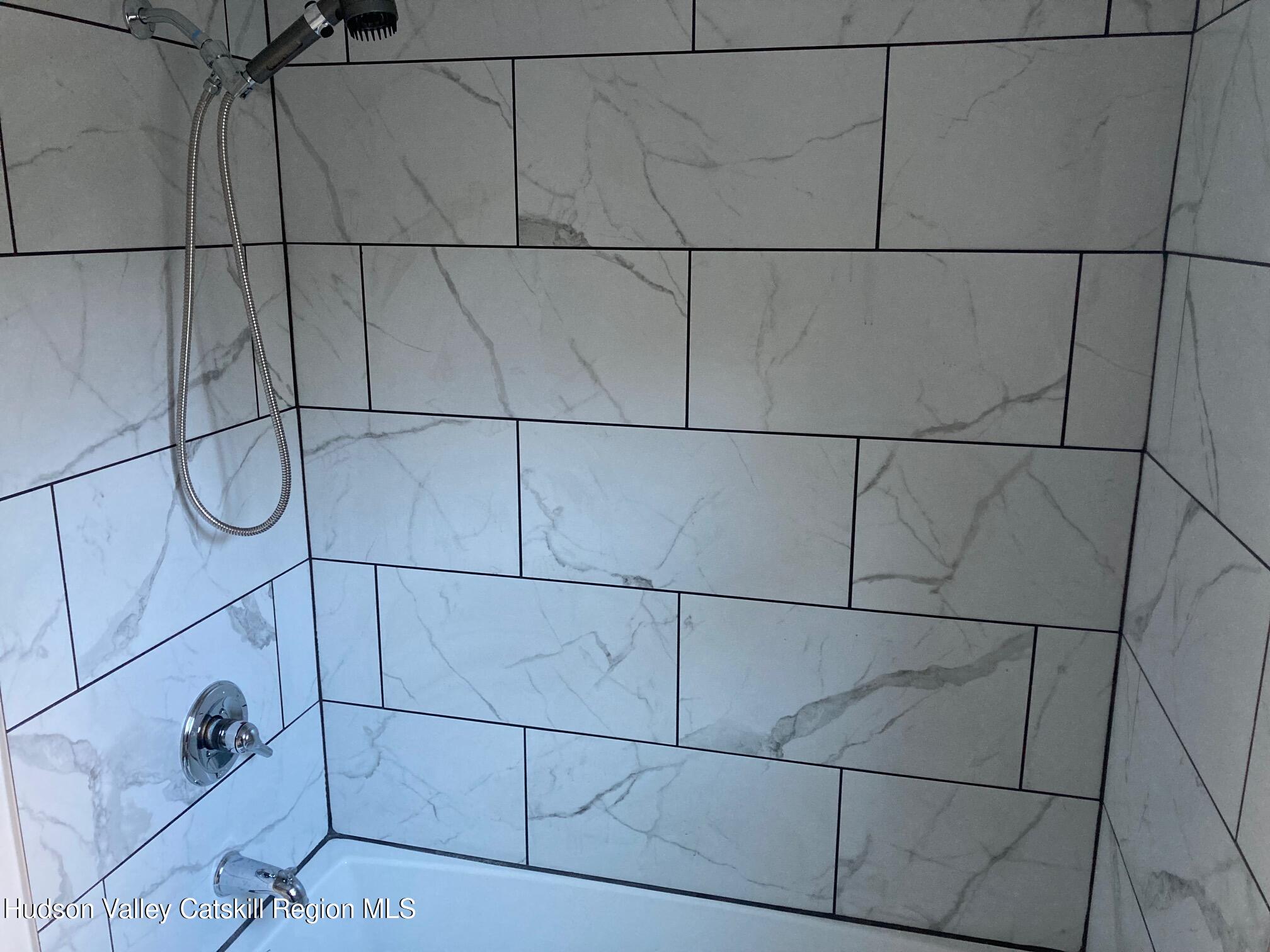 6 Elm Road Wurtsboro, NY 12790 - Photo 6 of 12 a bathroom with a glass shower door