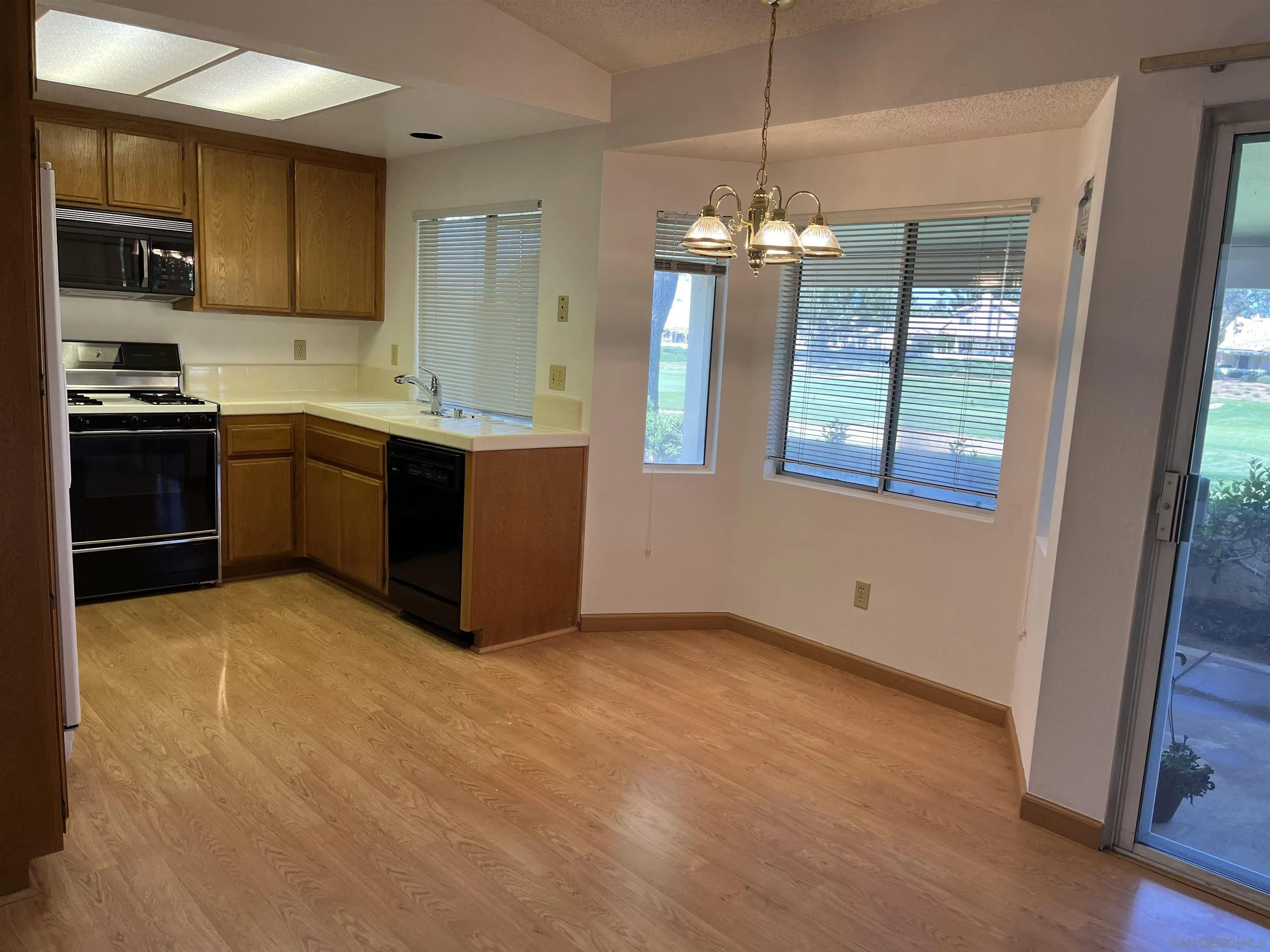 857 Pauma Valley Road Banning, CA 92220 - Photo 11 of 20 a kitchen with kitchen island granite countertop stainless steel appliances stove sink and cabinets