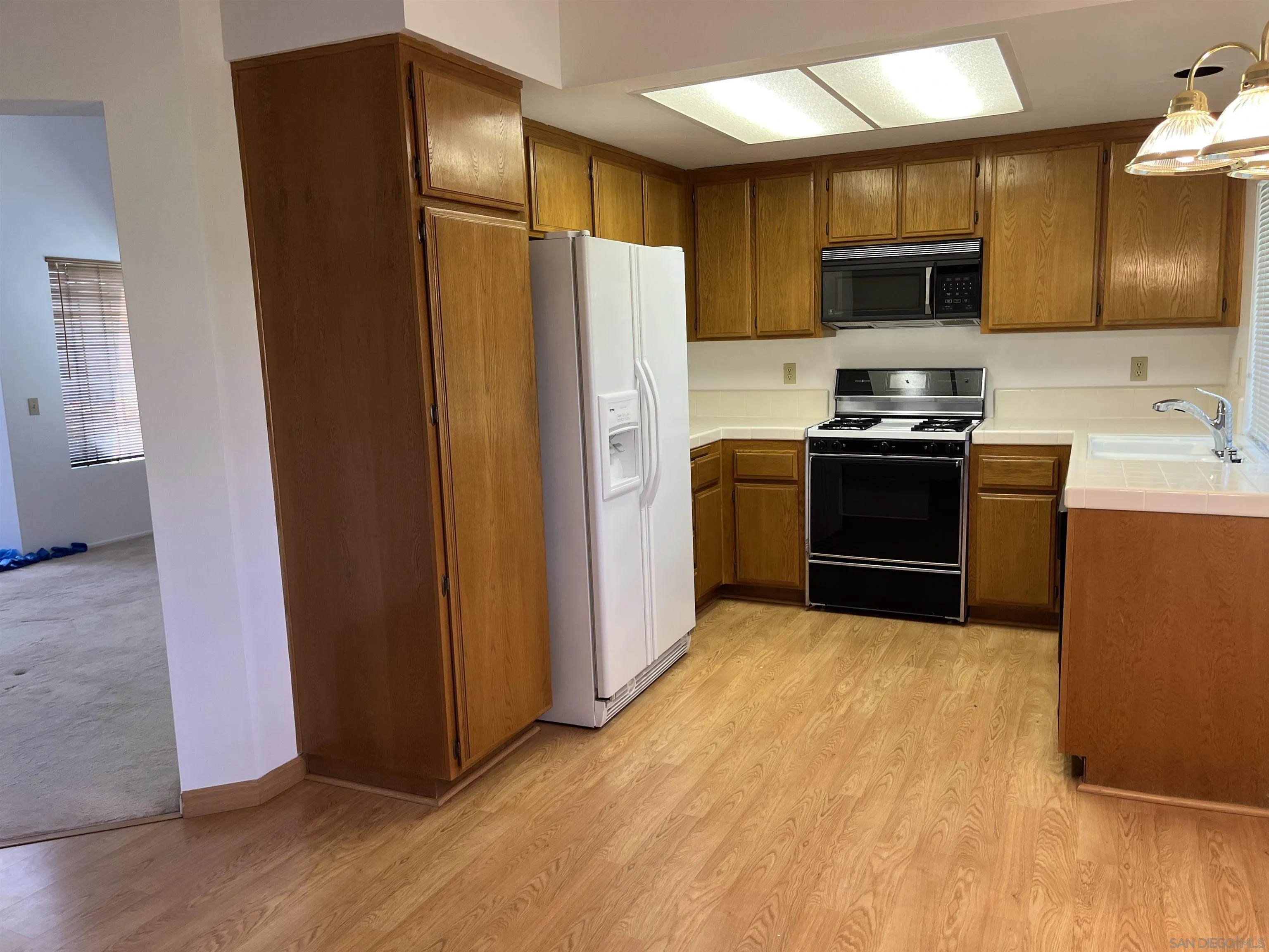 857 Pauma Valley Road Banning, CA 92220 - Photo 12 of 20 a kitchen with stainless steel appliances a refrigerator and a stove top oven