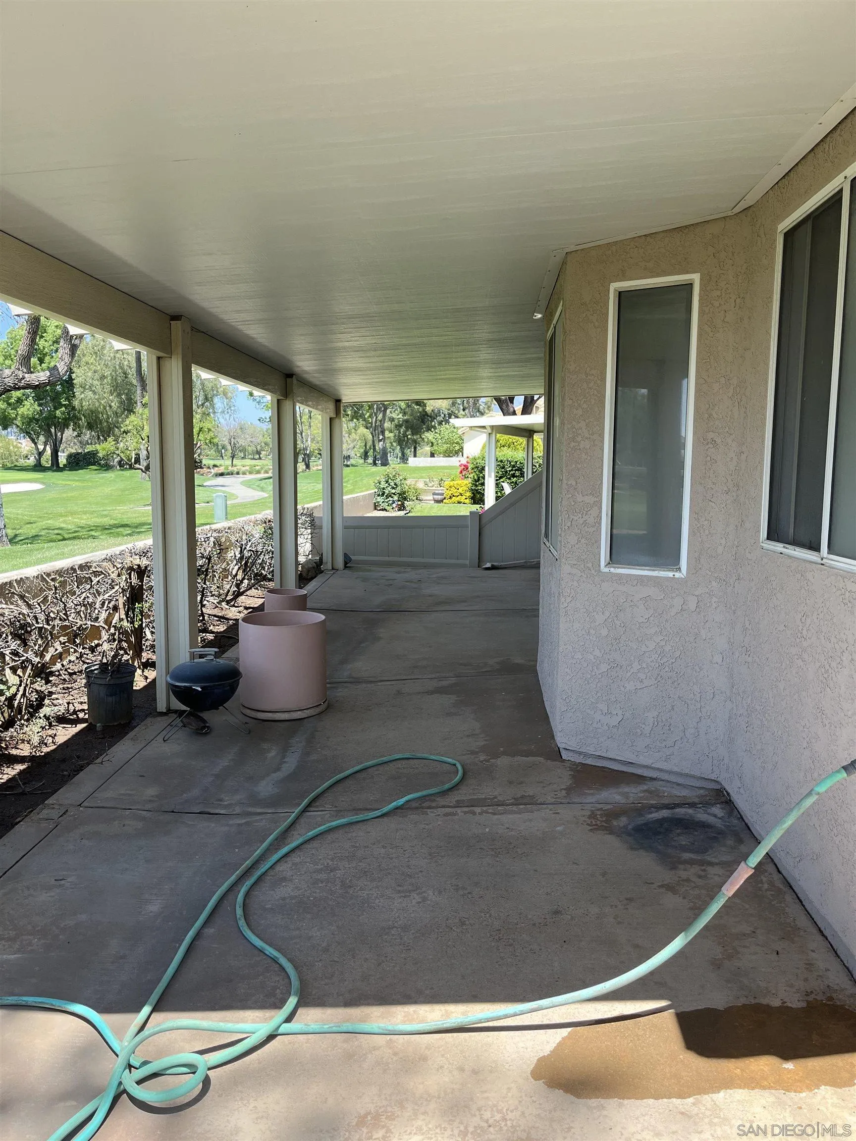857 Pauma Valley Road Banning, CA 92220 - Photo 14 of 20 a living room with furniture and a floor to ceiling window
