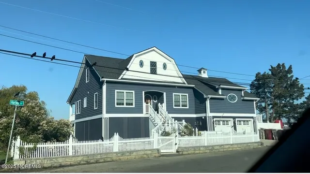 a front view of a house with a ocean view