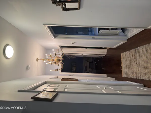 a living room with furniture and a mirror