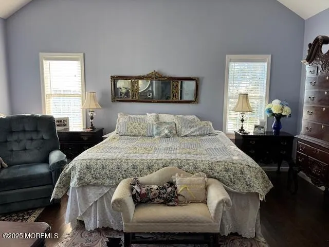 a living room with furniture and a mirror
