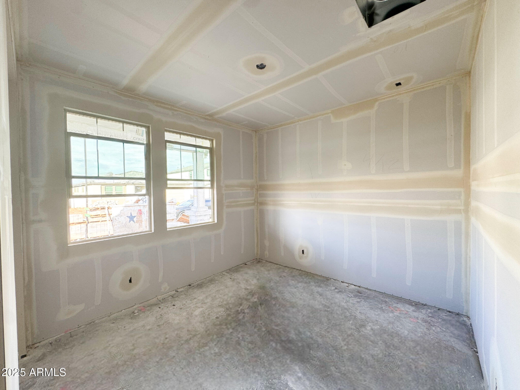 16225 West Bajada Road Surprise, AZ 85387 - Photo 4 of 18 a view of an empty room with a window