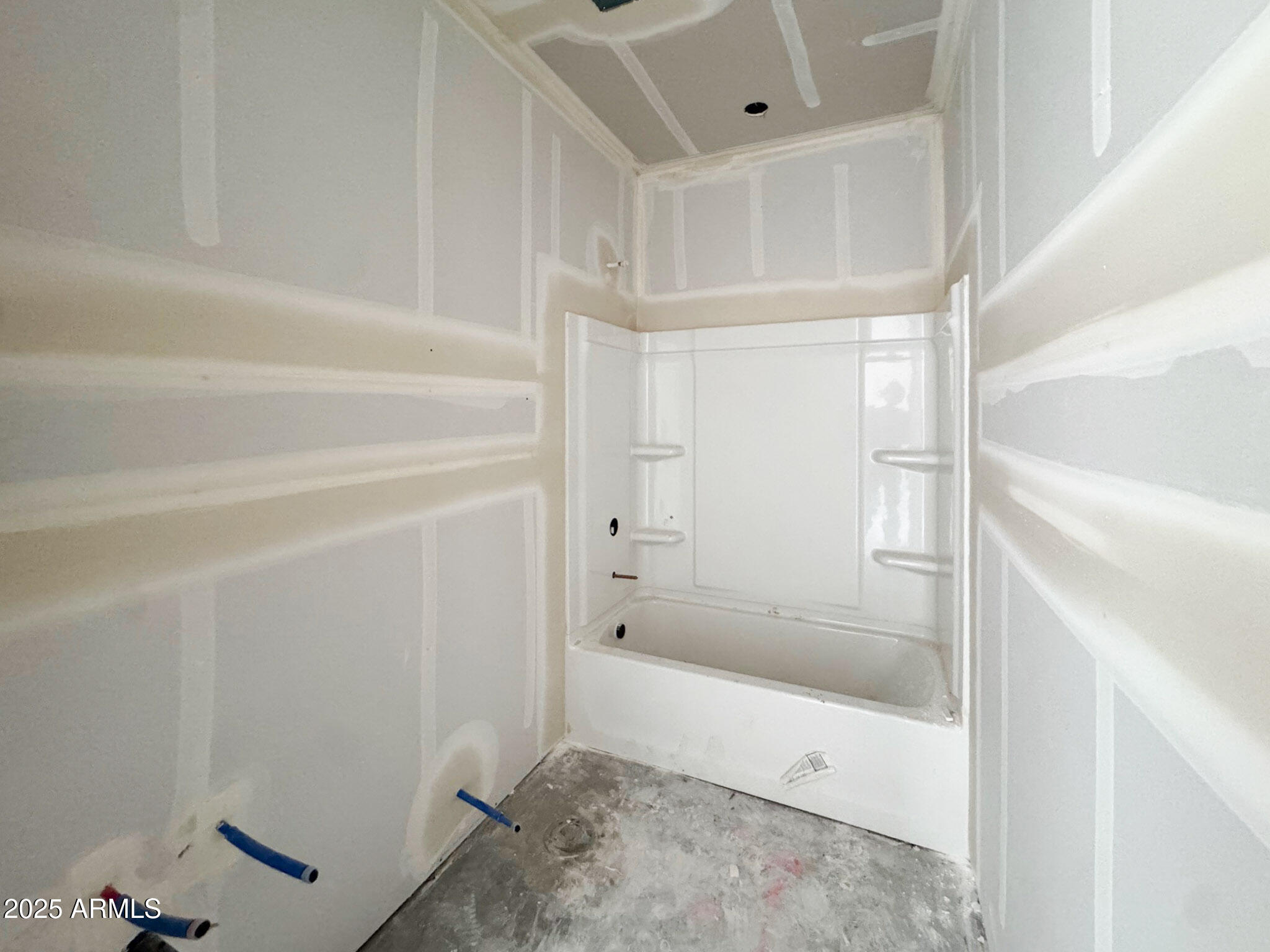 16225 West Bajada Road Surprise, AZ 85387 - Photo 5 of 18 a bathroom with a bathtub and a shower