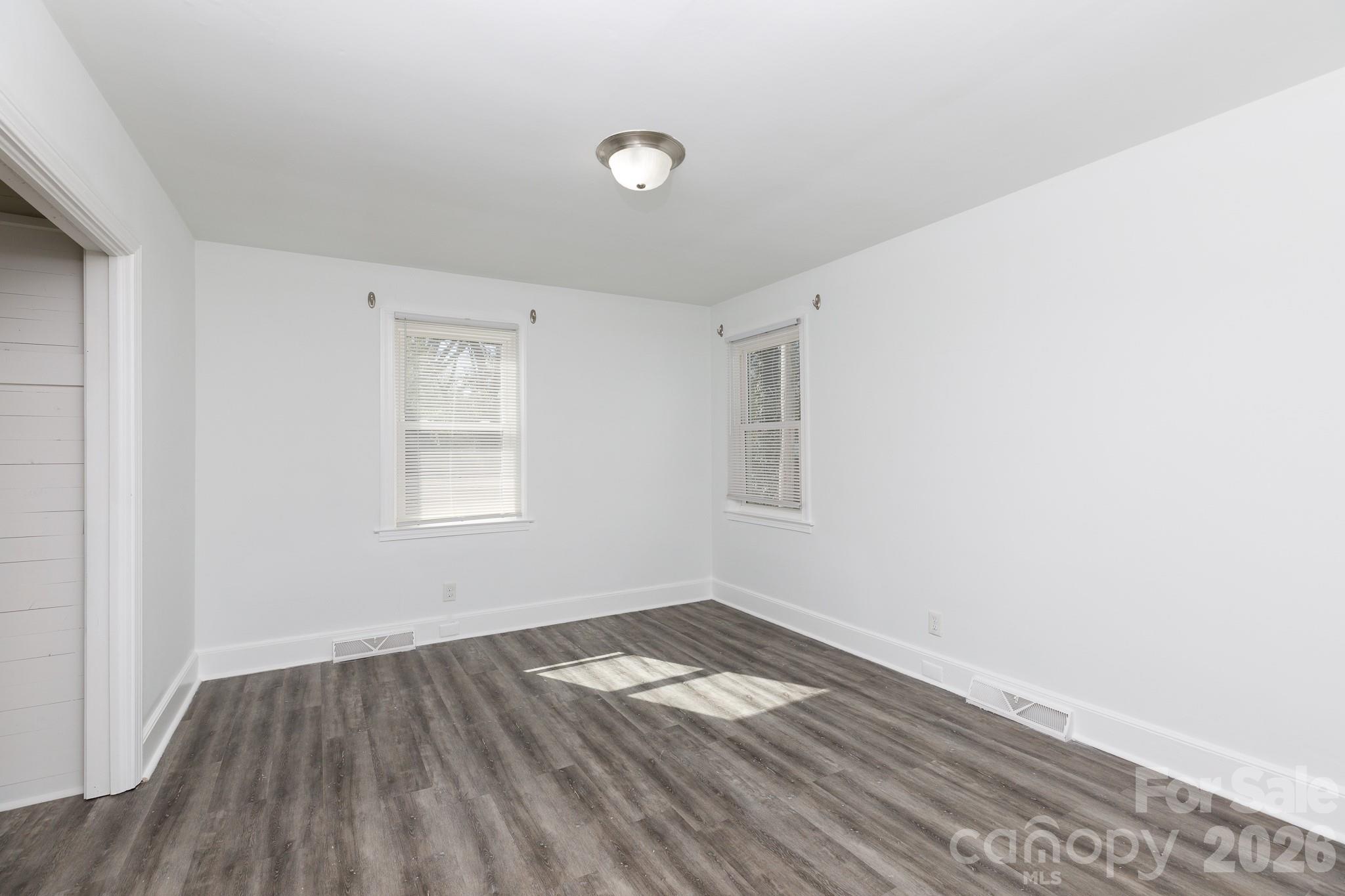 723 Finley Road Rock Hill, SC 29730 - Photo 12 of 22 an empty room with wooden floor and windows