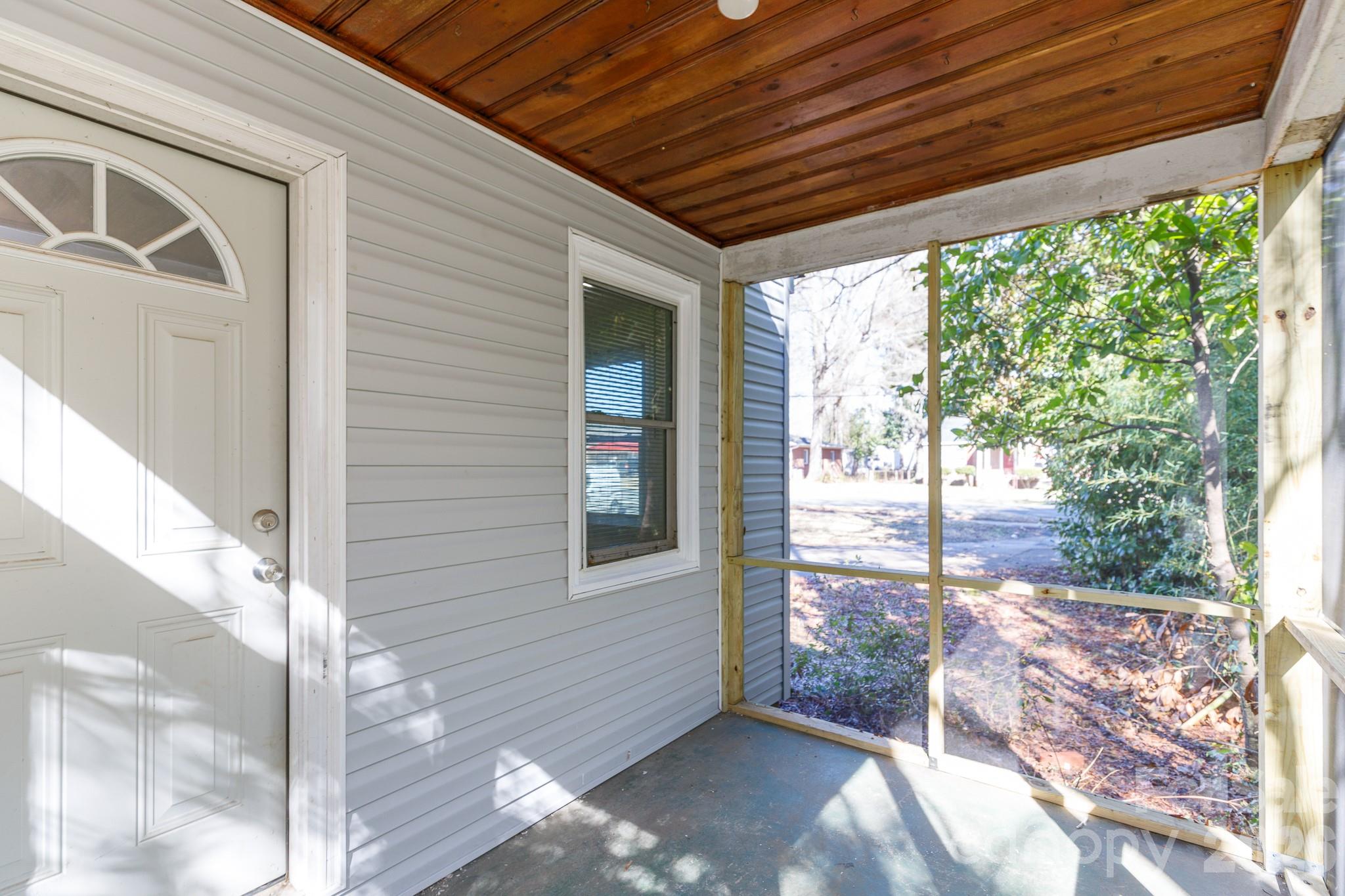 723 Finley Road Rock Hill, SC 29730 - Photo 18 of 22 a view of a porch with a table and chairs