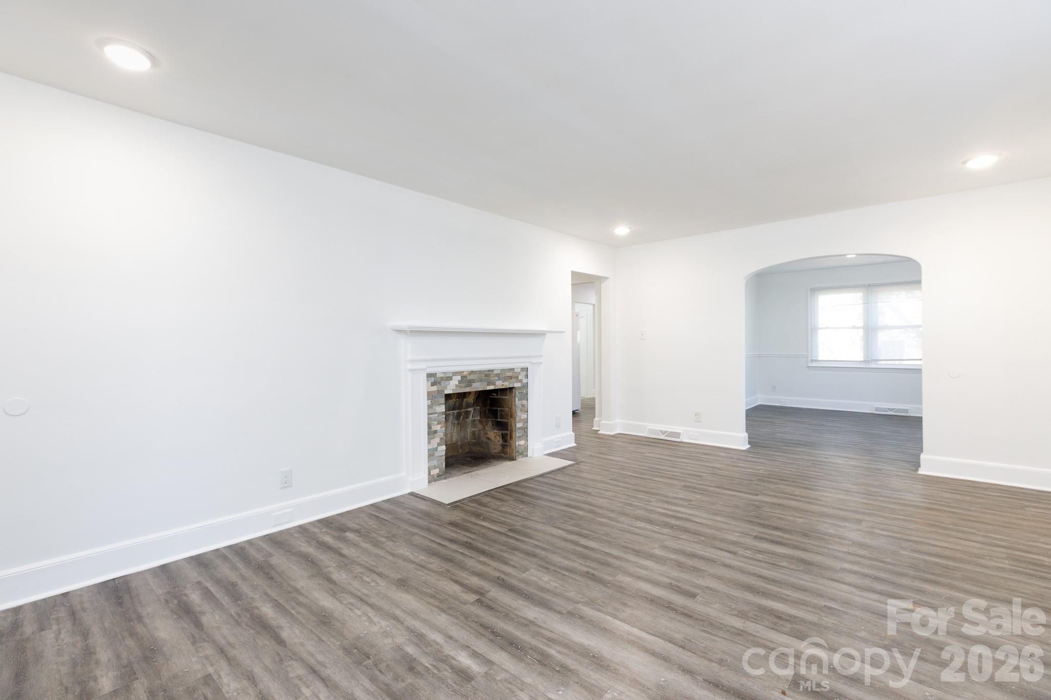 723 Finley Road Rock Hill, SC 29730 - Photo 4 of 22 a view of empty room with wooden floor and fireplace