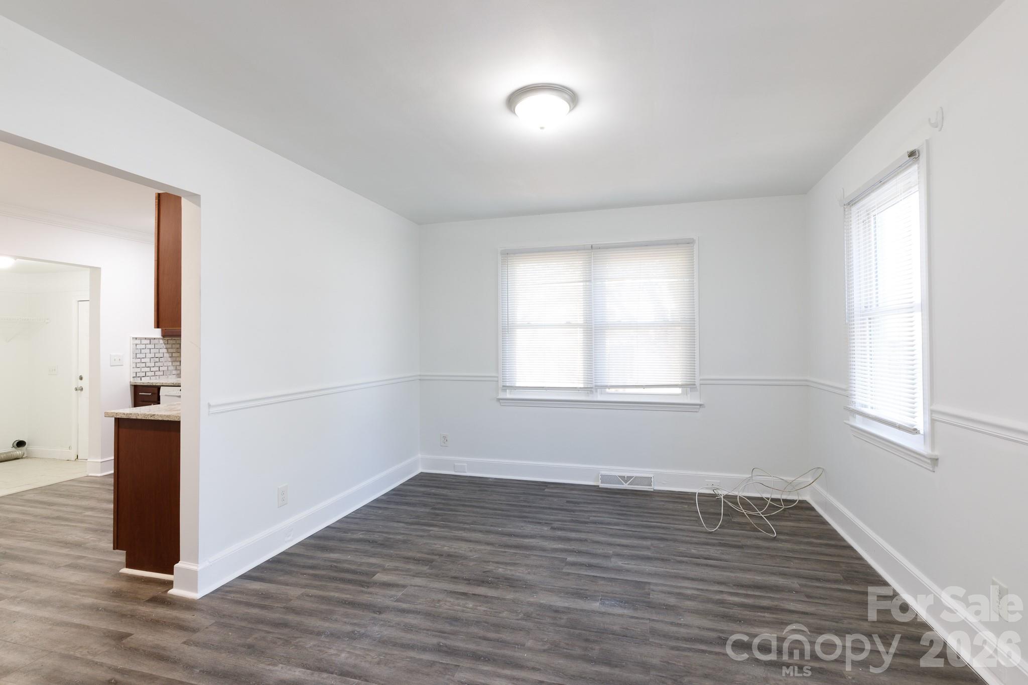 723 Finley Road Rock Hill, SC 29730 - Photo 5 of 22 an empty room with wooden floor and windows