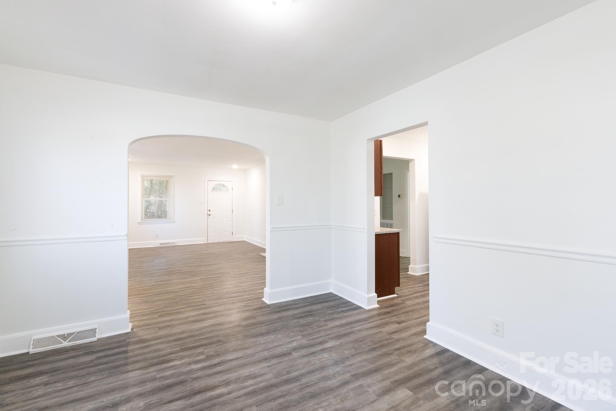 723 Finley Road Rock Hill, SC 29730 - Photo 6 of 22 an empty room with wooden floor and mirror