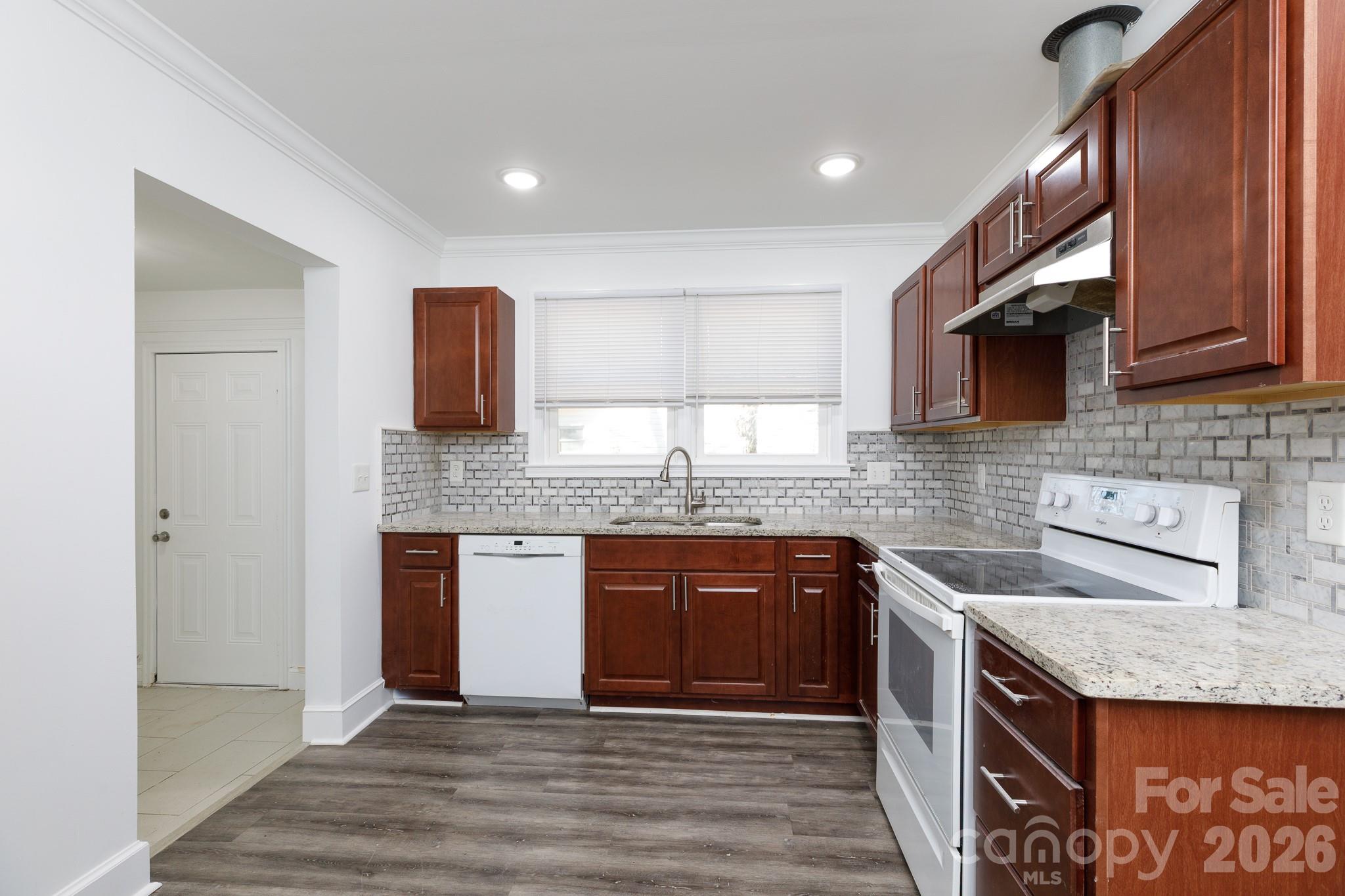 723 Finley Road Rock Hill, SC 29730 - Photo 9 of 22 a kitchen with stainless steel appliances granite countertop a sink stove and cabinets